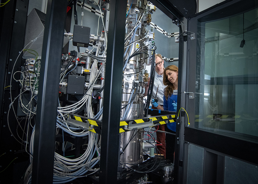 Two people looking into research lab